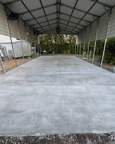 Concrete sidewalk alongside landscaped yard